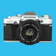 Olympus OM 30 35mm SLR Film Camera with Original Olympus 50mm Prime Lens Online now